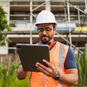 man looking at a clipboard