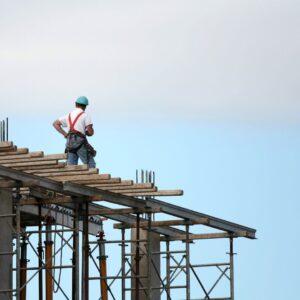 man standing on top of a roof